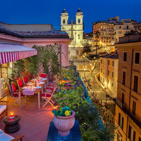 Admire the Spanish Steps, uplit at night, from your balcony