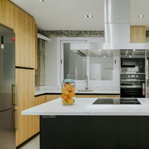 Rustle up a lazy brunch and mimosas in the sleek, modern kitchen