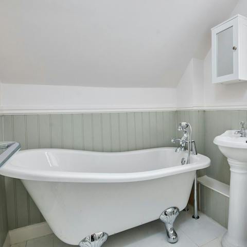 Unwind with a bath in the clawfoot tub after a busy day