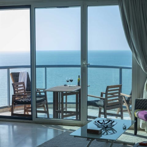 Share a bottle of arak on the balcony and listen to the sounds of the ocean