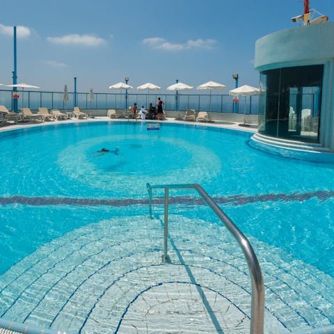 While away sunny afternoons in the luxury of the rooftop pool