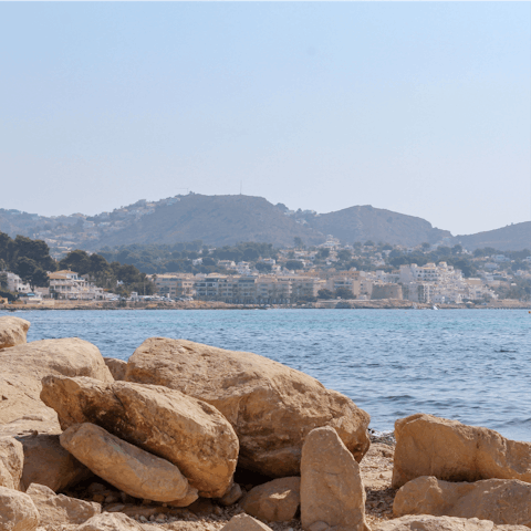Check out the stunning beach of Moraira, where you can try watersports or take a boat tour