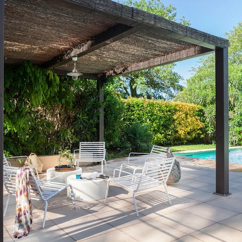 Relax under the shade of the pergola for a quiet afternoon with a good book