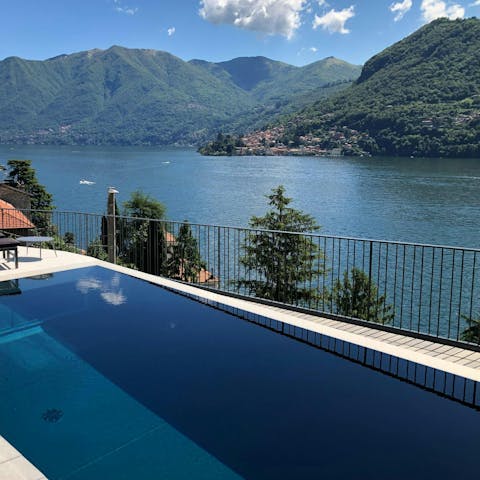 Admire the stunning views over the lake and mountains from the private pool