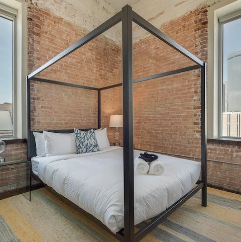 Fall asleep in the brick bedroom's four-poster bed