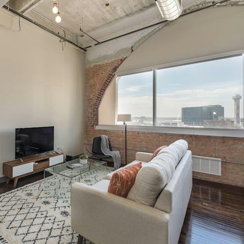 Take in views of Reunion Tower from your living room's arched window