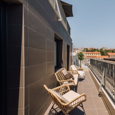 Sip coffee as the sun warms your skin on the private balcony
