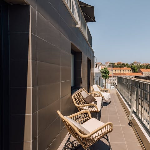 Sip coffee as the sun warms your skin on the private balcony