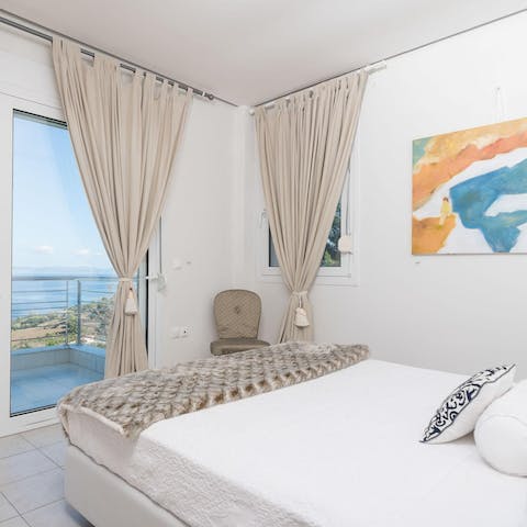 Wake up to sea views and sunshine in the sleek main bedroom