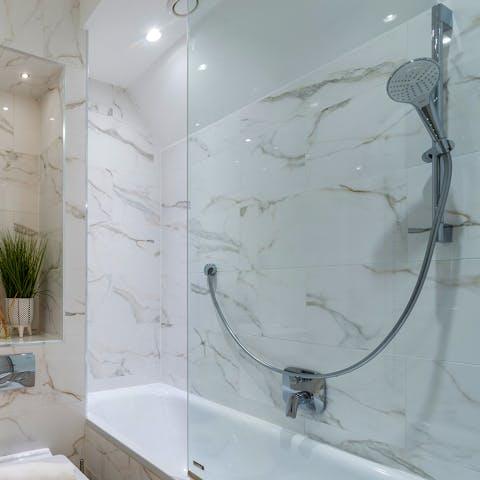Run a bubble bath in the luxurious marble bathroom after the day's adventure