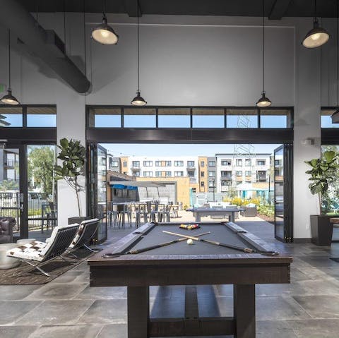 Get competitive in the communal games room over a round of pool