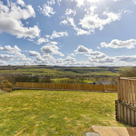 Take in scenic views over fields of green from the back garden