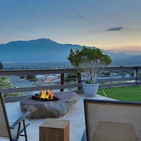 Open up a bottle of wine to share while taking in a glorious sunset over the mountains