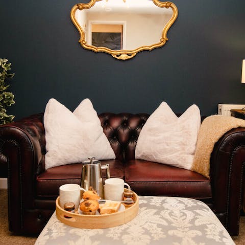 Relax with a glass of wine on your cosy loveseat, complete with chintzy cushions