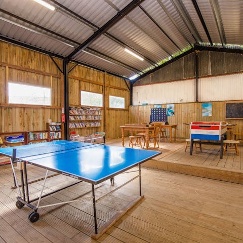 Challenge each other to a game of ping pong or table football in the games room