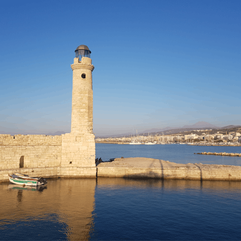 Drive into Rethymno Old Town and dine by the historic lighthouse
