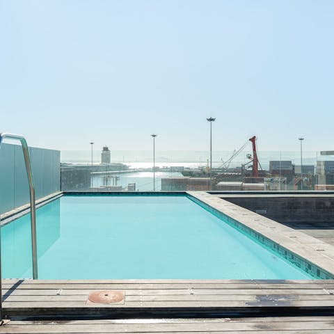 Swim in the shared rooftop pool and enjoy the view