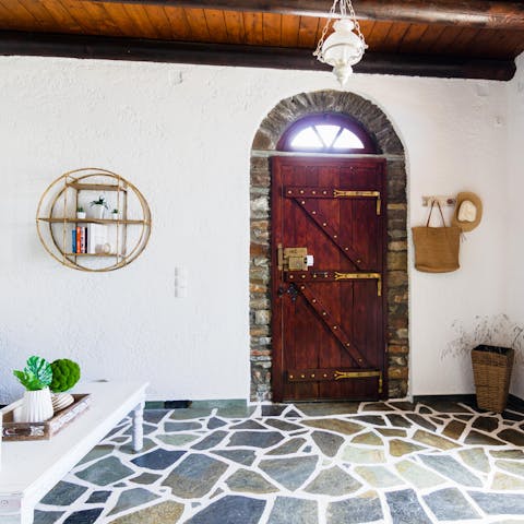 Step into the rustic charm of this villa, through the rich wooden door
