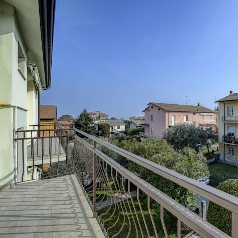 Enjoy the fresh air and blue skies from your own private balcony, accessible from multiple rooms