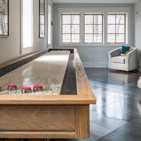 Challenge someone to a game or two of shuffleboard