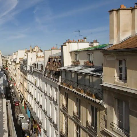 Explore the streets of Île Saint-Louis, basking in the charm and romance of the area
