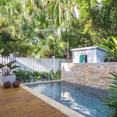 Cool off in the heated pool as water cascades down the wall