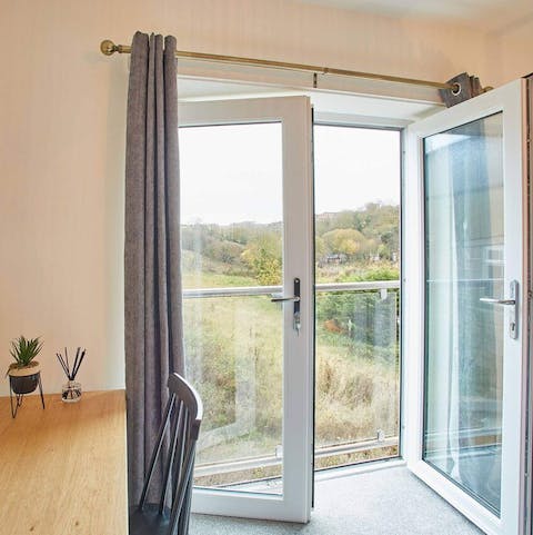 Enjoy garden views from the Juliet balcony in the master bedroom