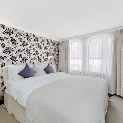Wake up to Mayfair views from your bedroom's arched windows