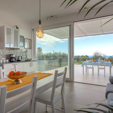 Let the natural sunlight in with large windows and sliding glass doors to the terrace and veranda