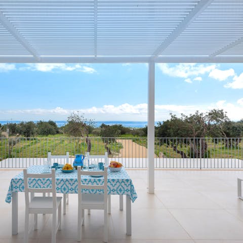 Sit out on the panoramic terrace with a stunning view of the sea and countryside
