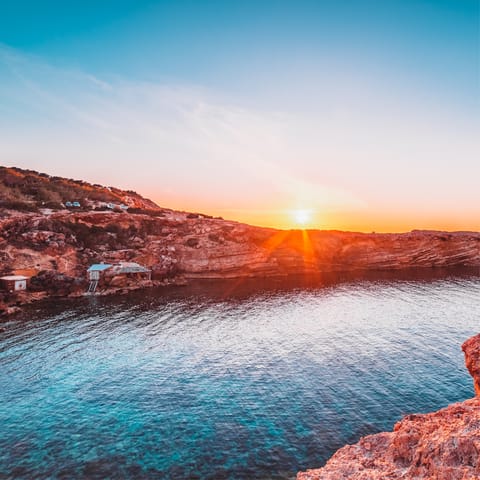 Explore the rugged coastline of Ibiza and find stunning beaches and coves