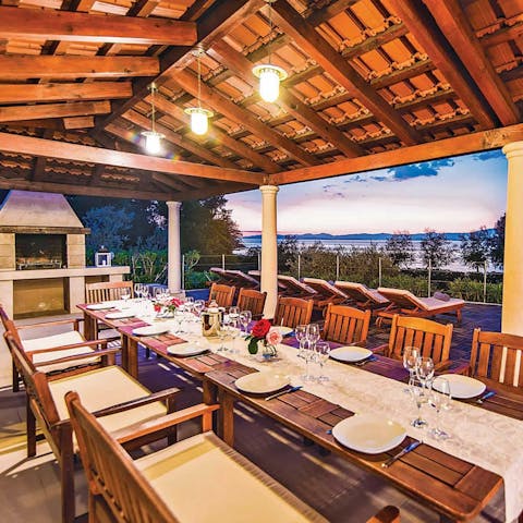 Dine al fresco on the covered terrace equipped with a built-in barbecue
