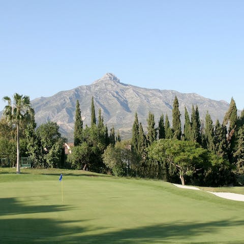 Tee off on the picturesque golf course nearby, overlooking the mountain