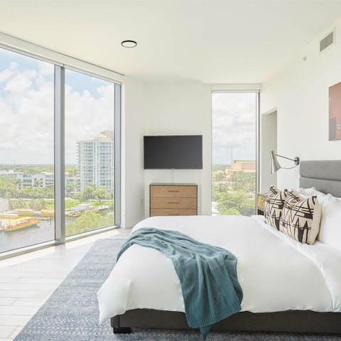 Wake up to canal vistas from your bed