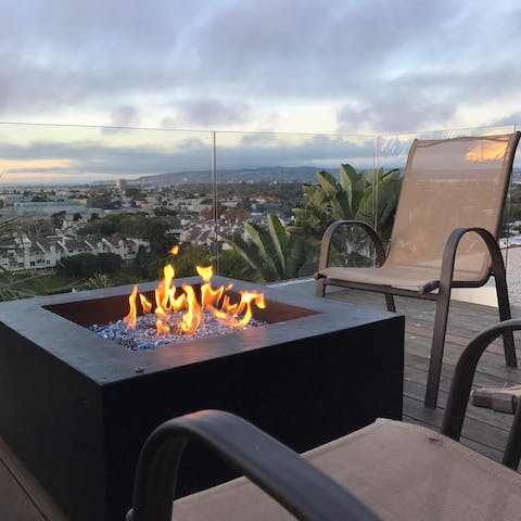 Sip cocktails around the fire pit 