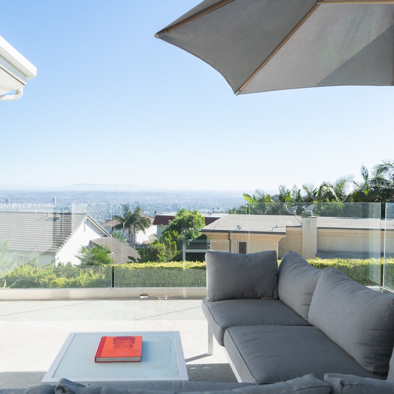 Sip on a glass of red on the balcony, overlooking Los Angeles