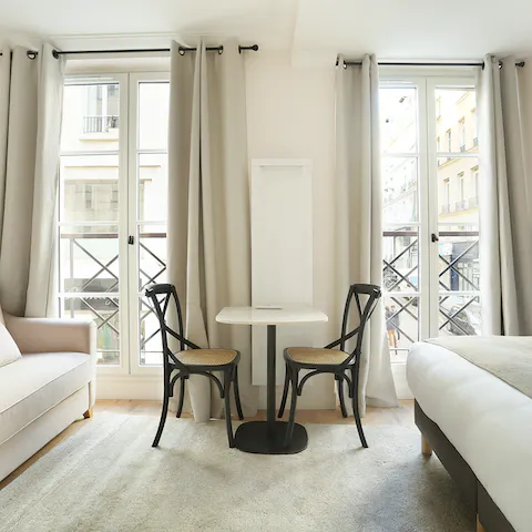 Sit down to fresh coffee and croissants at the chic bistro-style table while admiring 2nd arrondissement views