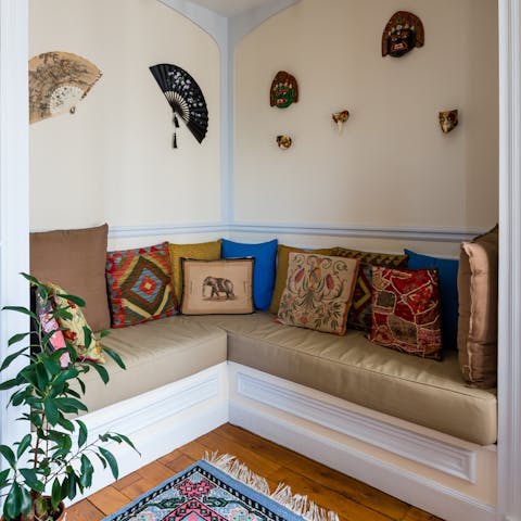 Relax in the living room's seating nook, decorated with objects from around the globe