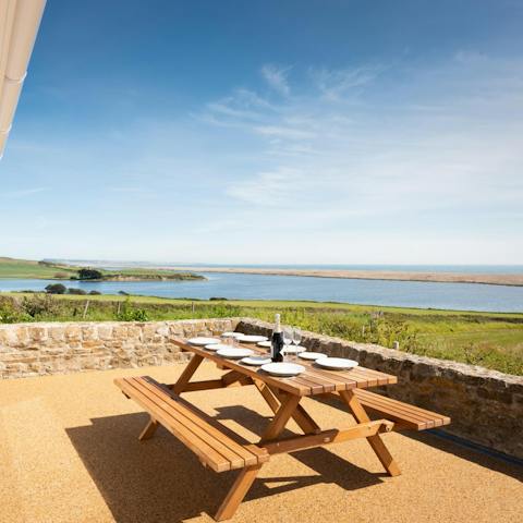 Soak in views of Fleet Nature Reserve from the spacious outside terrace area