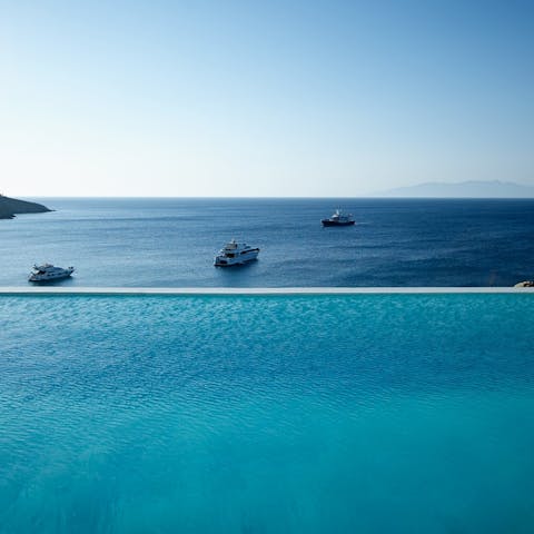 Watch the yachts sail by from your private infinity pool