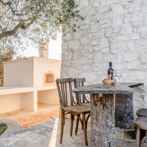 End each day with an alfresco aperitif under the olive tree