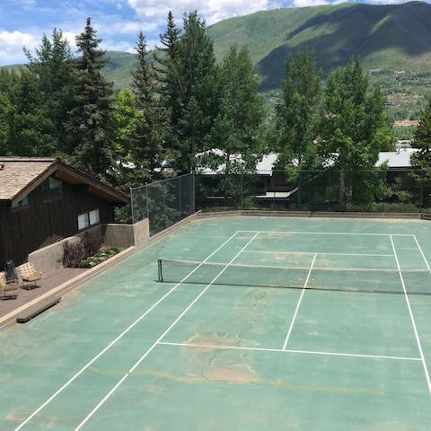 Host a game of tennis in the fresh mountain air