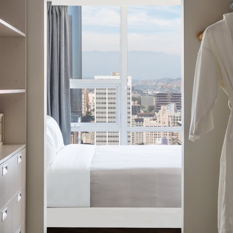 Take in the cityscape views from your bedside 