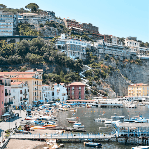 Explore the picturesque seaside town of Sorrento, with colourful houses and winding streets