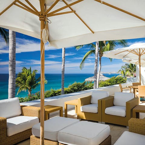 Relax  in the shade with stunning views of the ocean 