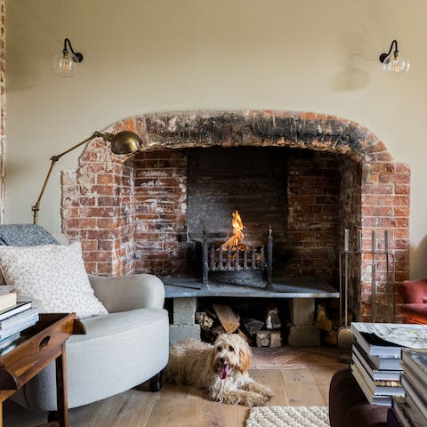 Cosy up by the rustic brick hearth
