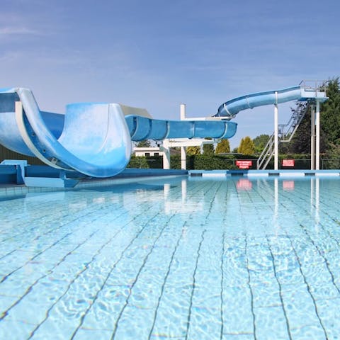 Keep up with your fitness regime in the pool while the kids try the flumes