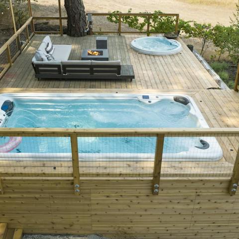 Relax and unwind on the private patio, with a hot tub and a spa pool for your enjoyment 