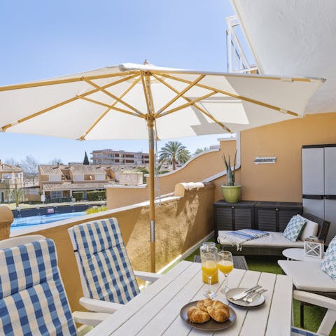 Toast your getaway with a glass of sangria on the balcony