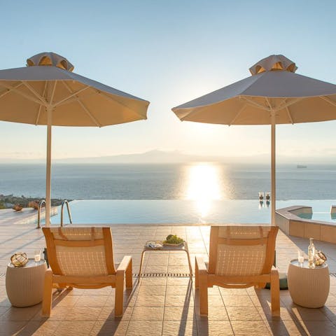Lie back on a lounger and watch the sun set over the Ionian Sea